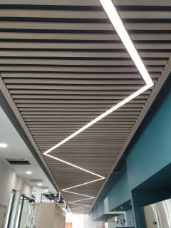 Acoustic Ceiling with Lighting - Slatted Oak over Black Fabric with Acoustic Insulation Behind - Zig Zag Light (2)